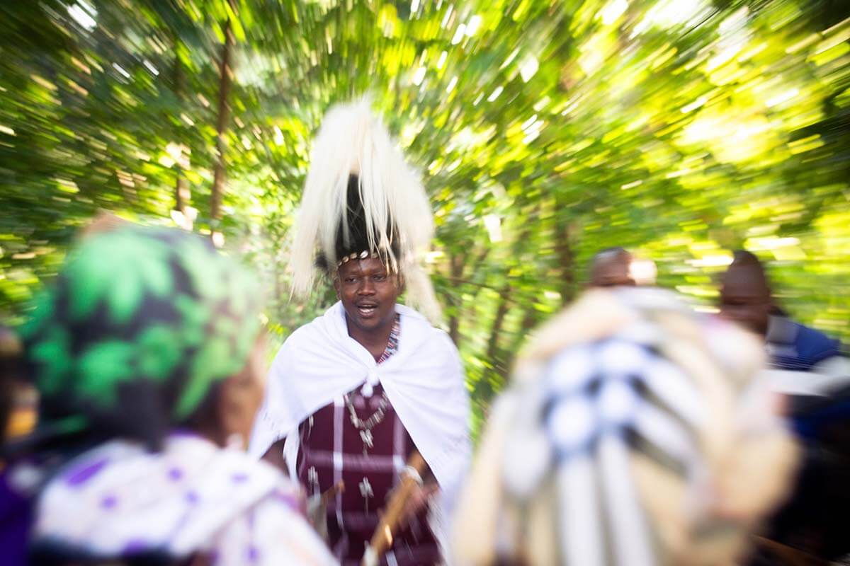 Agostine Mwanaah, Program Coordinator at SALT, leads a dance with Elders after morning prayers at a SALT meeting. Photo: Rory Sheldon