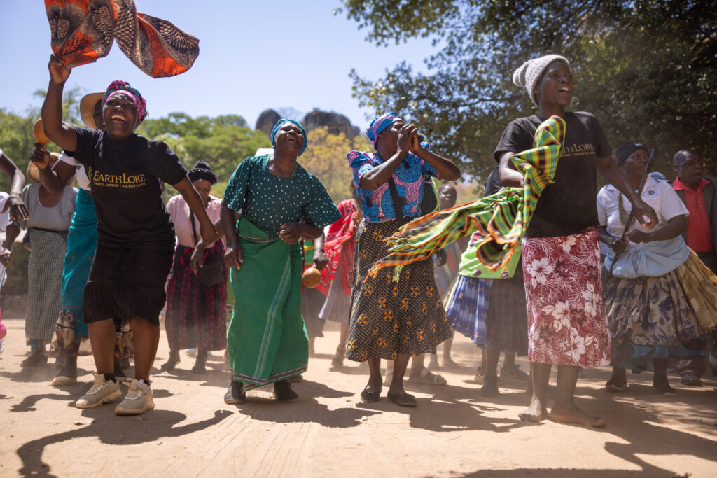 The women of Chirorwe and Mutsinzwa dancing and singing in celebration, by Simon de Swardt